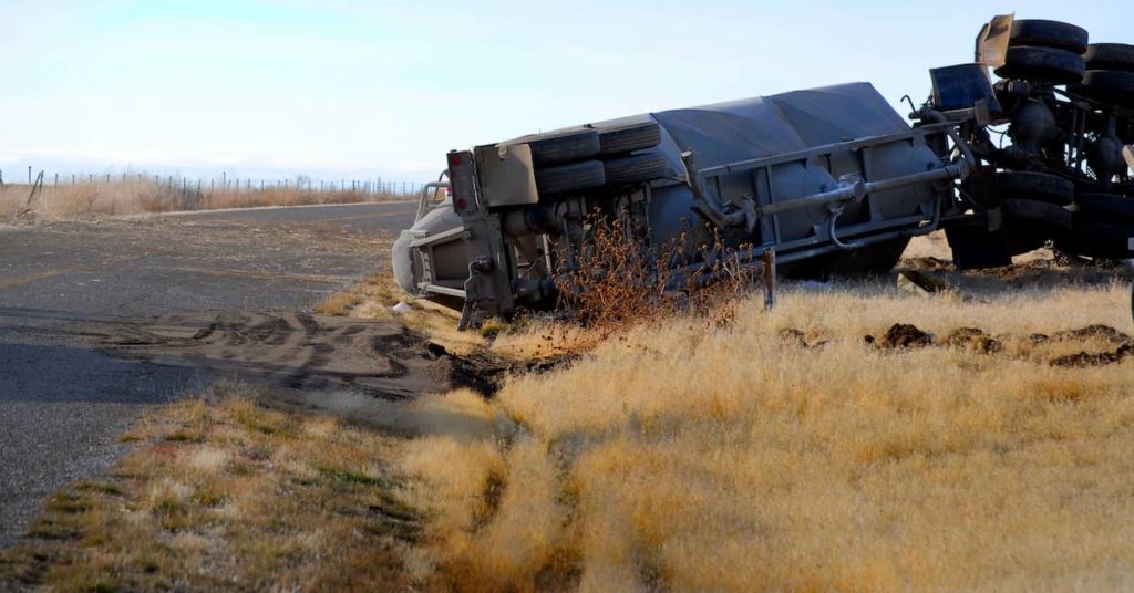 semi-truck overturned on a country road after an accident