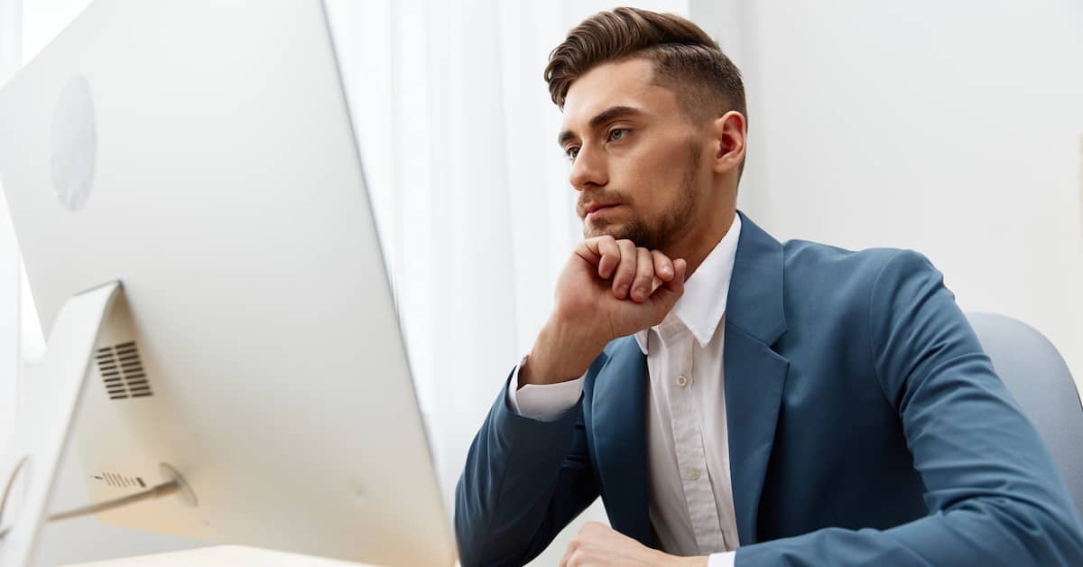 personal injury attorney calculating client's pain and suffering damages on a computer