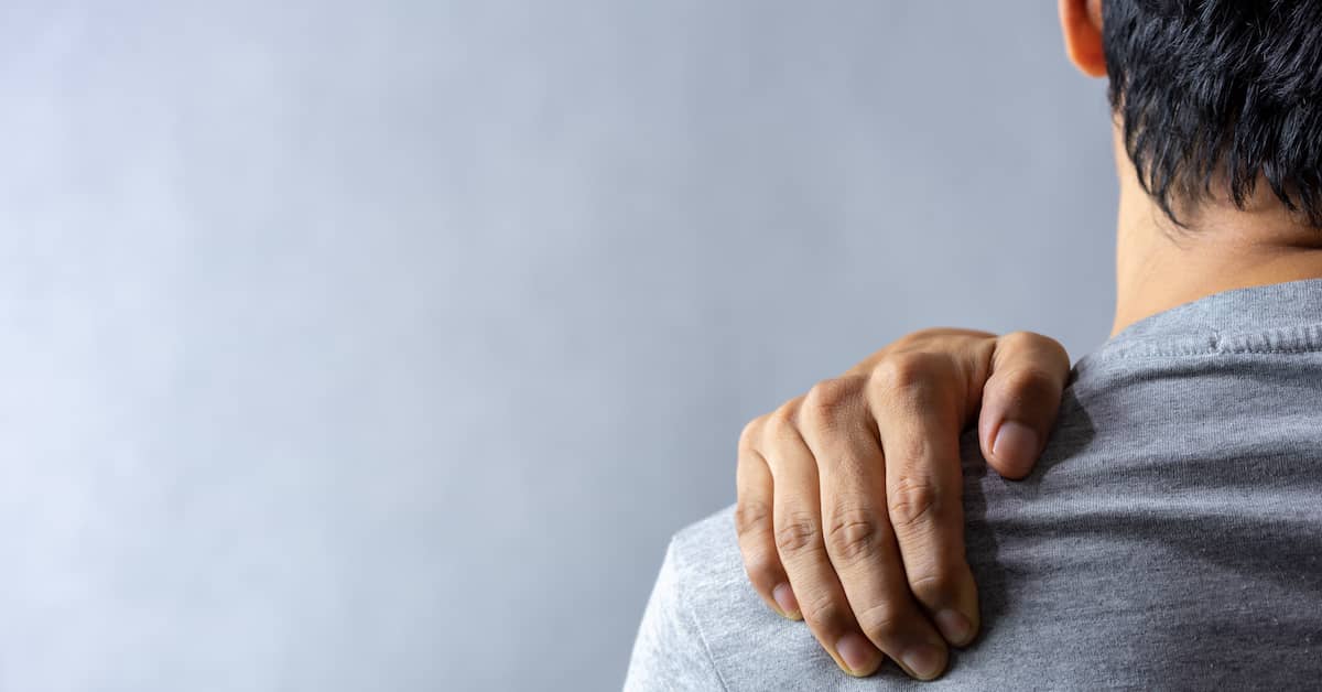 young man with shoulder pain after a car accident