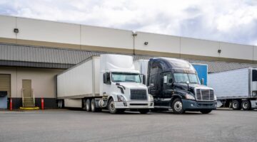 Semi-trucks receiving cargo at a shipping company | Hauptman, O'Brien, Wolf & Lathrop