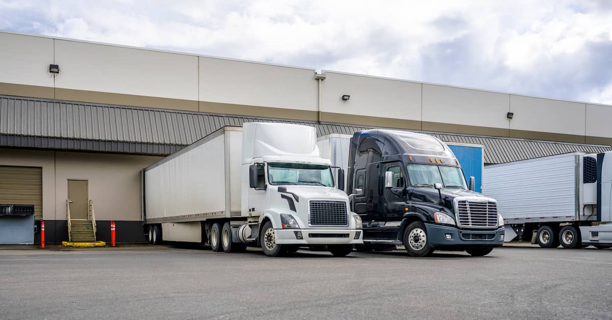 Semi-trucks receiving cargo at a shipping company | Hauptman, O'Brien, Wolf & Lathrop