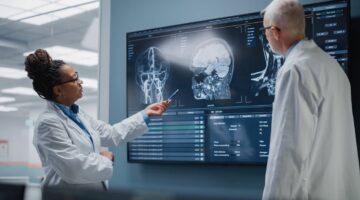 Doctors checking medical imaging of the brain after a car accident for signs of a brain bleed | Hauptman, O'Brien, Wolf & Lathrop