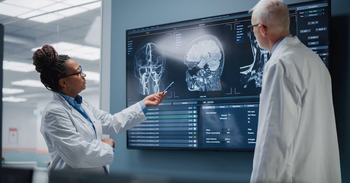 Doctors checking medical imaging of the brain after a car accident for signs of a brain bleed | Hauptman, O'Brien, Wolf & Lathrop