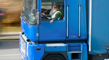 Truck driver driving his truck at high speed.