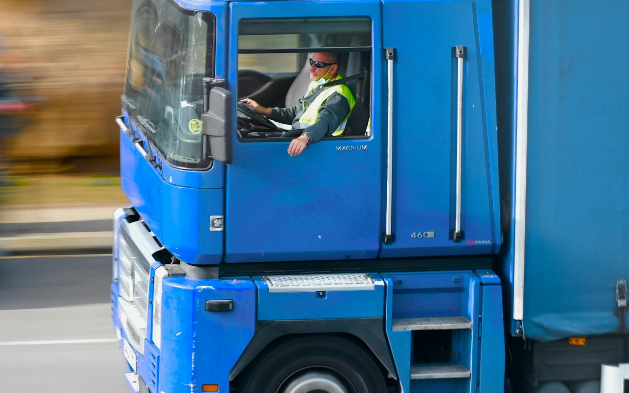 Truck driver driving his truck at high speed.